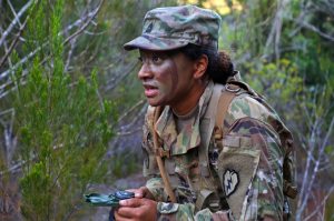 A soldier uses a lensatic compass during land navigation qualification, part of the Tropic Lightning Best Warrior Competition at Schofield Barracks, Hawaii, April 9, 2018. Army photo by Sgt. Ian Ives